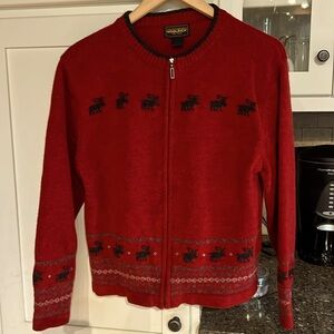 Ladies large Woolrich front zip sweater.